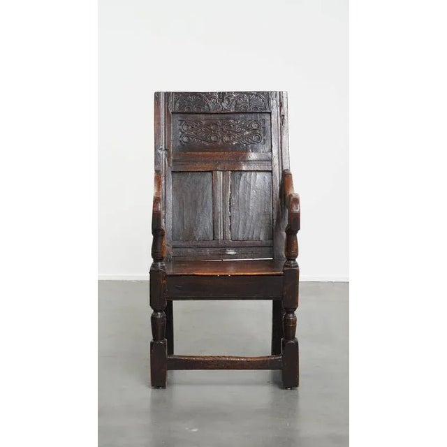 Offered this beautiful stately antique oak Wainscot chair/ side chair from the 17th century with a warm color scheme. This...