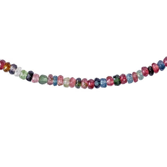 Rainbow tourmaline, unsorted. Pink next to green next to amber next to black, no two strands would come out the same. The...