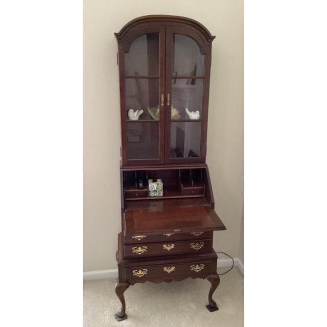 Elegant vintage Queen Anne style secretary desk with hutch top, featuring a classic arched bonnet crown, glass display...