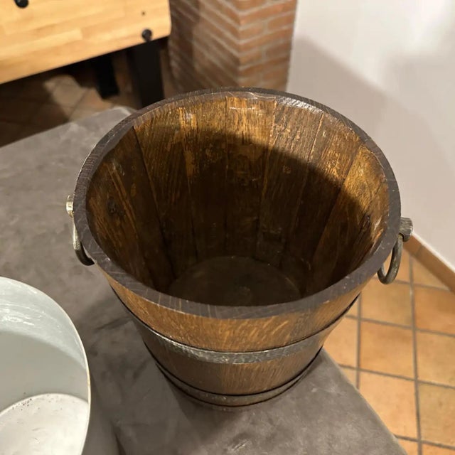 An amazing oak and wrought iron wine cooler hand-crafted in France in the Seventies, it's in original condition with...