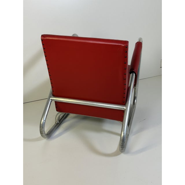 the armchair with its curved tubular structure recalls the Italian rationalist design of the early decades of the...