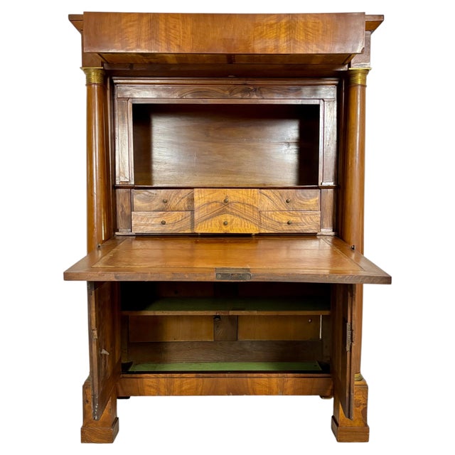 Elegant French Empire secretaire abattant crafted in walnut, featuring striking book-matched veneer, ebonized column...