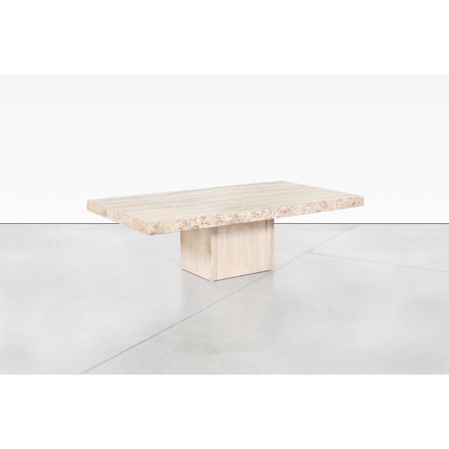 Fantastic vintage Italian modernist travertine coffee table manufactured by Stone International in Italy, circa 1970s. The...