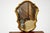 A small vintage Italian gilt wall mirror with an ornate gilded with a cartouche-shaped frame with scalloped edges. Maker’s...