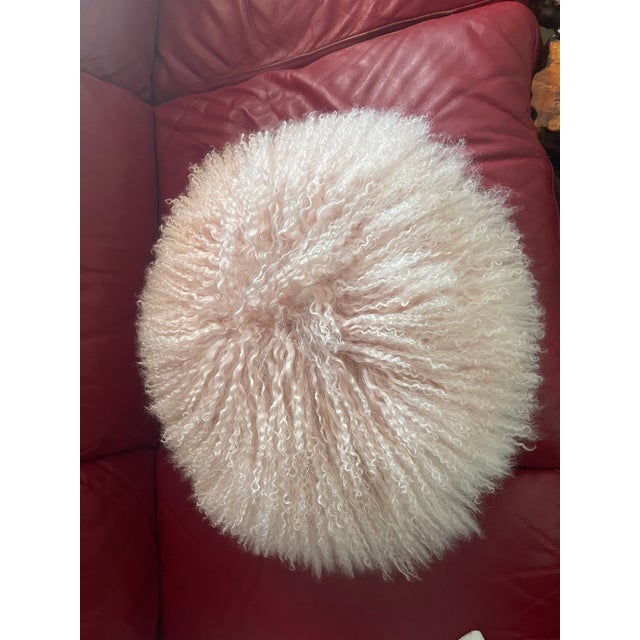 Blush pink long Mongolian fur round pillow.