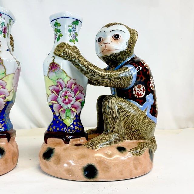 Vintage Home is pleased to present this pair of vintage Majolica Chinoiserie Figural Vases. Each Figural features a monkey...