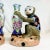 Vintage Home is pleased to present this pair of vintage Majolica Chinoiserie Figural Vases. Each Figural features a monkey...