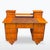 An elegant Biedermeier writing desk from the early 19th century, made of veneered fruitwood with warm honey tones and a...