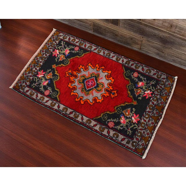 Welcome to our curated collection of Anatolian textiles. This captivating hand-knotted small rug brings authentic vintage...