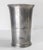 We are offering this early American pewter beaker cup. This cup has nice simple and elegant form with three central...