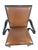 A sophisticated vintage armchair by Baker Furniture, pairing warm brown leather upholstery with an ebonized-finish wood...