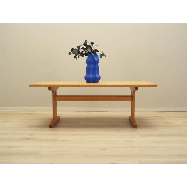 The coffee table was made in the 1970s, Danish production. The structure and top of the bench are covered with ash veneer....