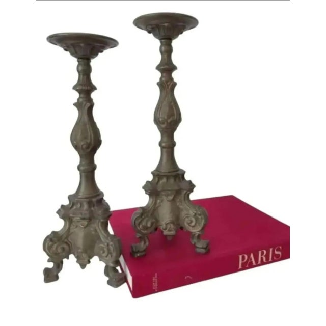 For your consideration. . . A fabulous pair of old bronze metal altar style candle holders. They are made of heavy bronze...