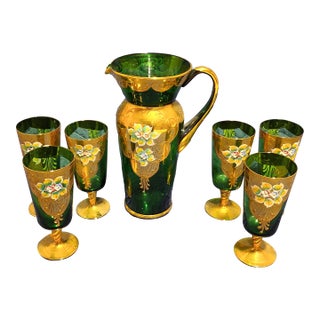 Early 20th Century Late Victorian Bohemian Emerald Green Enameled & Gilt Art Glass Beverage Set With Pitcher and Six Goblets - 7 pcs For Sale