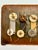 A distinctive vintage modernist assemblage featuring an artful composition of vintage buttons, hand-knotted twine, and...