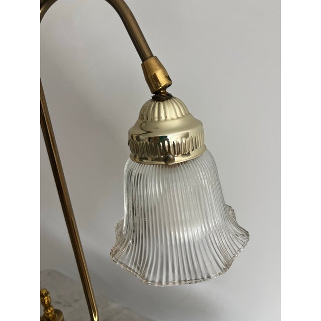 Up for consideration is a beautiful vintage brass tulip style lamp with a glass shade. This would look lovely in your...