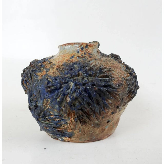 Vintage hand built studio pottery vase. High relief barnacle like organic application in dark blue and iron oxide glaze....