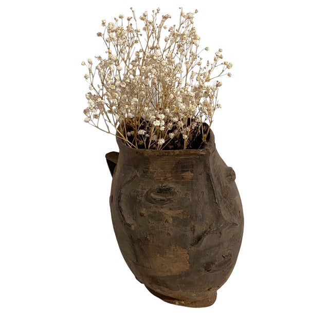 A well carved Kuba wooden cup in the form of a human head. Figural cups such as this cups are among the most popular...
