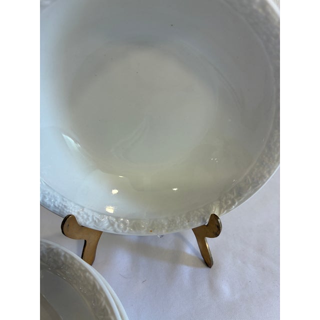A set of four vintage Wedgwood & Co. Ltd. Hedge Rose bowls made in England and dated November 1963. Each creamy white bowl...