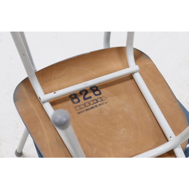 Set of 2 dining chairs by Dico Netherlands from the 1950's. The chairs have the original pastel blue color which is...