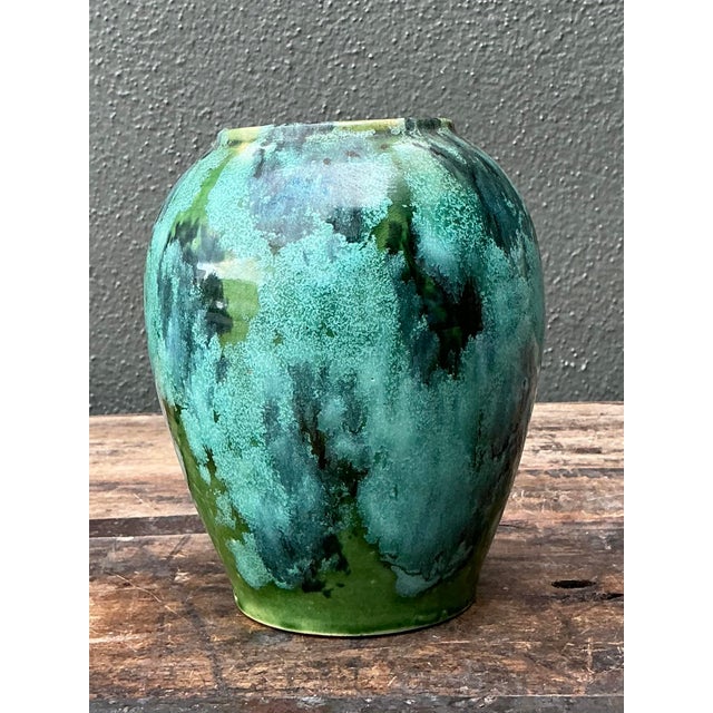 This captivating vintage French ceramic vase is a stunning example of the mid-century art pottery tradition. Its elegant,...