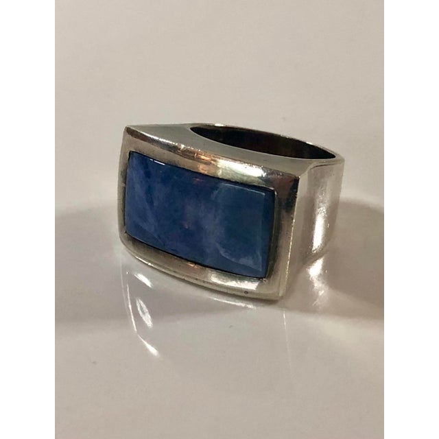 This vintage 1990s Peruvian Sodalite Sterling Silver Cocktail Ring by Ilaria is a beautiful show stopper -- perfect paired...
