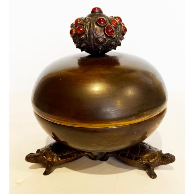 Fantastic hand crafted brass container held afoot by three turtles and capped with an urchin encrusted with agate...