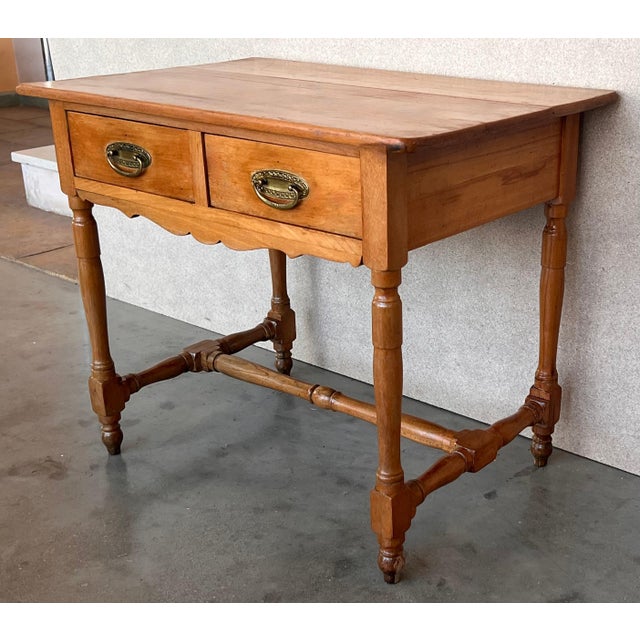 A charming early 20th century Spanish pine farm table with four tapered legs and a wonderfully well-worn finish from a...