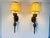 Pair of Wall Lights Sconces in brass, featuring an antique brass or bronze-toned metal body with a twisted-stem detail and...