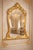 An impressive antique European Baroque and Rococo style console mirror dating from the early 1900s, beautifully...
