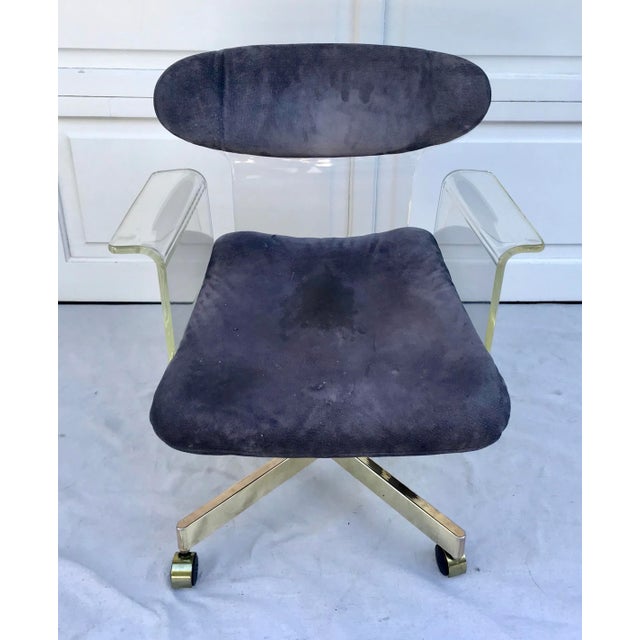 This is a STUNNING chair from the 1960's made of molded lucite complete with an oval shaped backrest and swan-like...