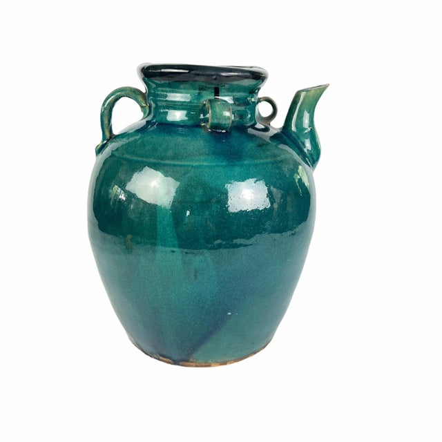 Antique Chinese stoneware wine jug with a rich teal green glaze and black glaze around the rim. c. 1800s Dimensions:...