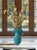 Crafted in the style of Archimede Seguso, this vintage Murano art glass vase features a distinctive flared and curled rim...