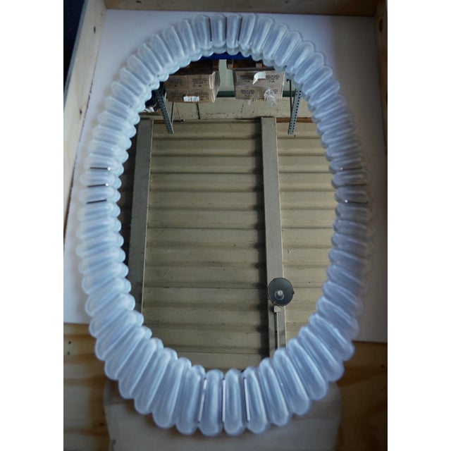 A stunning Murano glass mirror in a sparkling ice white color, Venice. A mirror that will adorn your home on its own. The...