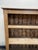 A late 19th-century English pine bookshelf dating to around 1890, featuring three open shelves and a simple, practical...