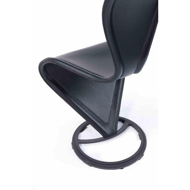 A striking set of four “s” chairs, designed by tom dixon and produced by cappellini in the 1990s, one of the most...