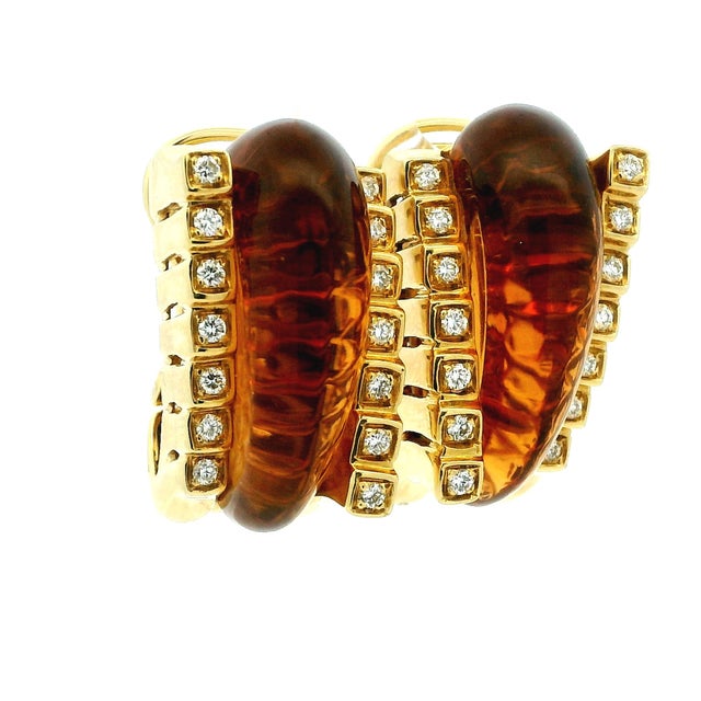 A sophisticated pair of signed Roberto Legnazzi earrings crafted in 18 karat yellow gold, Italy, circa 1990. The design...