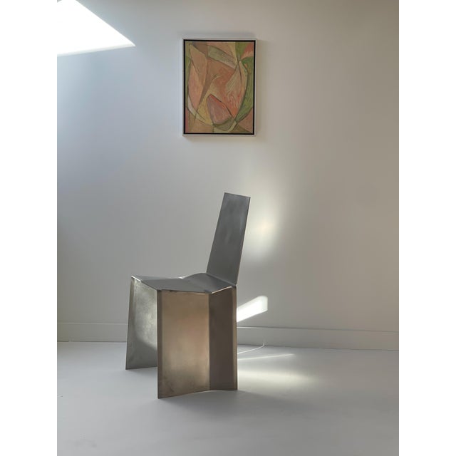 Remarkable design piece that exemplifies the Dutch designer's minimalist and functional approach. Made from a single sheet...