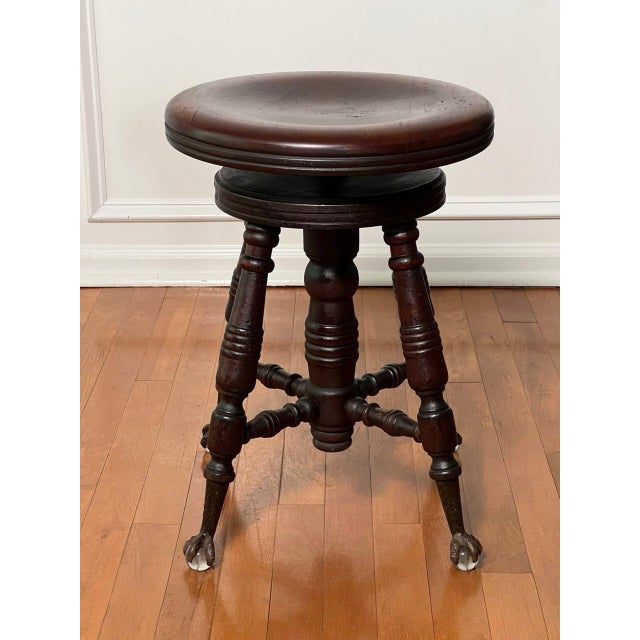 Victorian mahogany adjustable swivel piano stool with claw and glass ball feet by A. Merriam & Co., Massachusetts, circa...