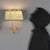 Italian-made wall lamps dating back to the 1940s and 1950s, featuring a brass frame that lends a classic aesthetic. The...