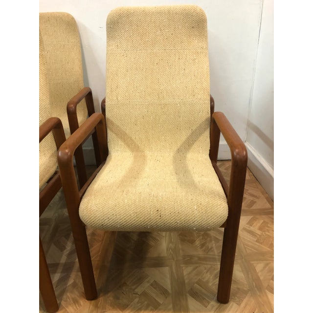 Set of four high back dining arm chairs by Dyrlund in great condition with original super clean fabric. (two sets of four...