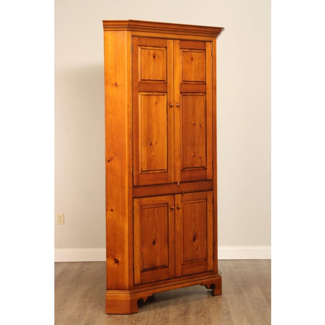 High Quality Custom Crafted Pine Corner Cabinet with Four Paneled Doors Opening to Shelf Storage