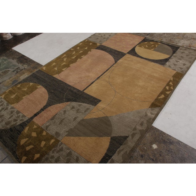 Made in unique blend of hand-knotted wool and silk, this 6x10 modern rug is a unique addition to the Modern Classics rug...