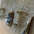 Pair of textured ice glass wall sconces. Made in Austria in the 1950s with chrome back plates. These gorgeous textured...