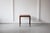 A smart and stylish rosewood side table from Denmark, rectangular in shape, featuring a lovely grain on its top and...