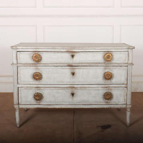 Good early 19th century French painted three drawer oak commode with oversized brass handles. 1820. This piece is designed...