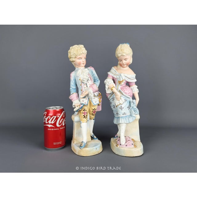 1900s Pair of German Bisque Porcelain Cinderella Scene Statues These lovely statues feature a scene of Cinderella, that...