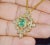 Gorgeous GIA certified natural emerald and diamond pendant. Pendant has a stunning diamond studded floral / leaves design...
