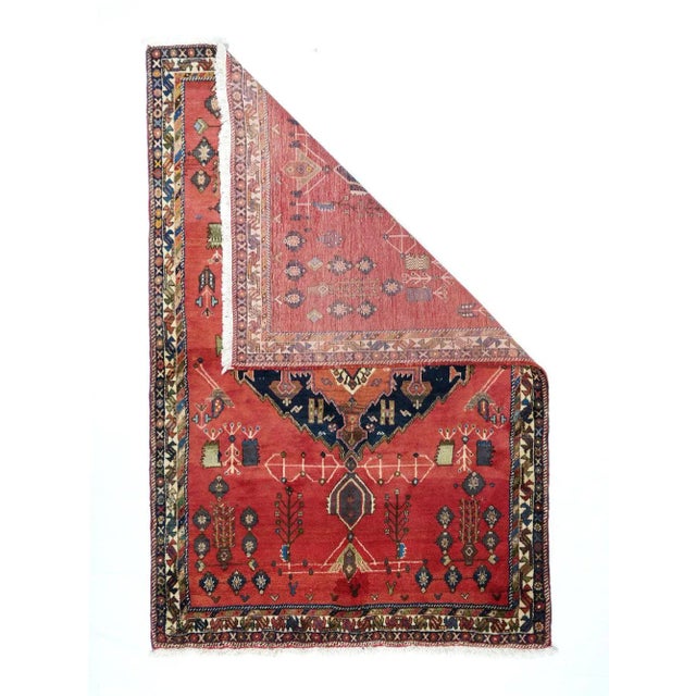 Sort of a Gabbeh, but much more complex in pattern, with a crimson field centred by a jagged navy medallion enclosing a...