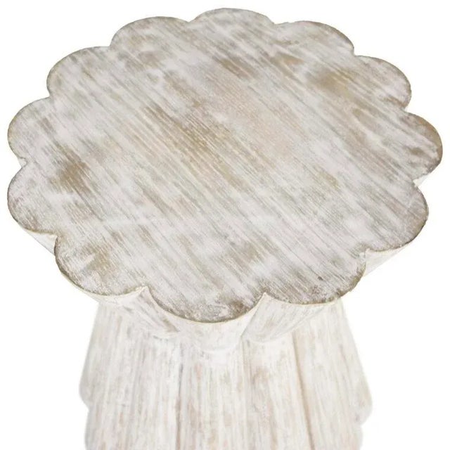 The Annie Scalloped Side Table Finished in a Light Washed Woodgrain texture, the hourglass silhouette and scalloped flower...